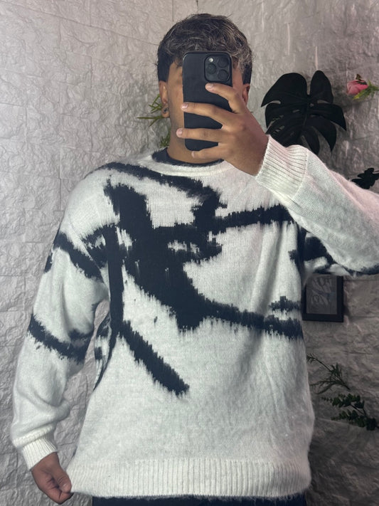 Maglione nero e bianco con fantasia astratta effetto spazzolato