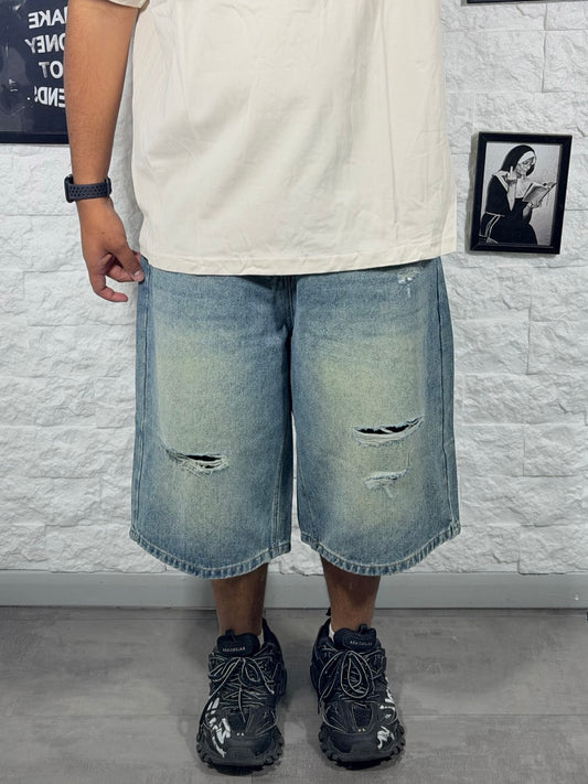 Jeans jort chiaro in denim con strappi