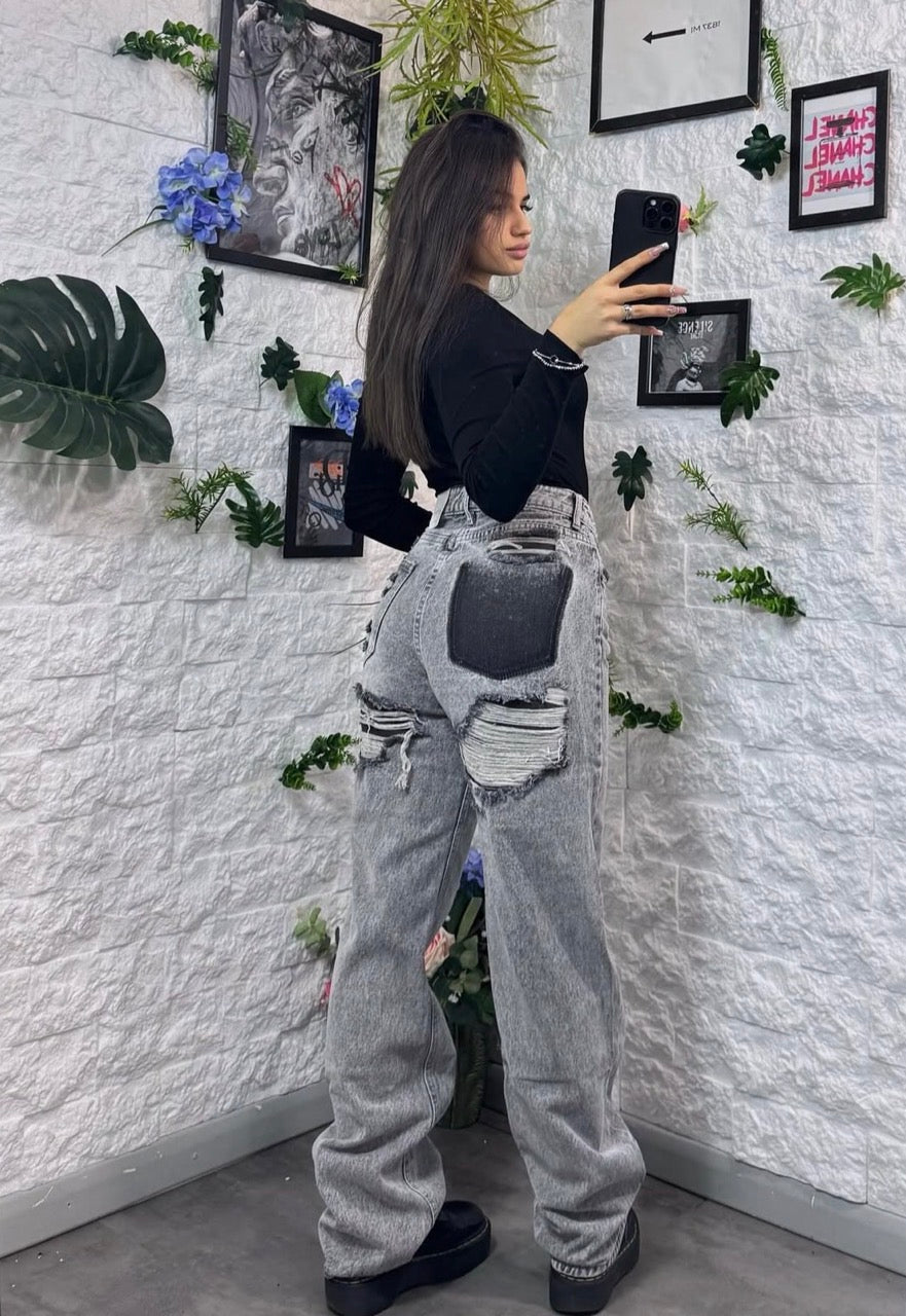 Jeans a palazzo grigio chiaro con finti strappi