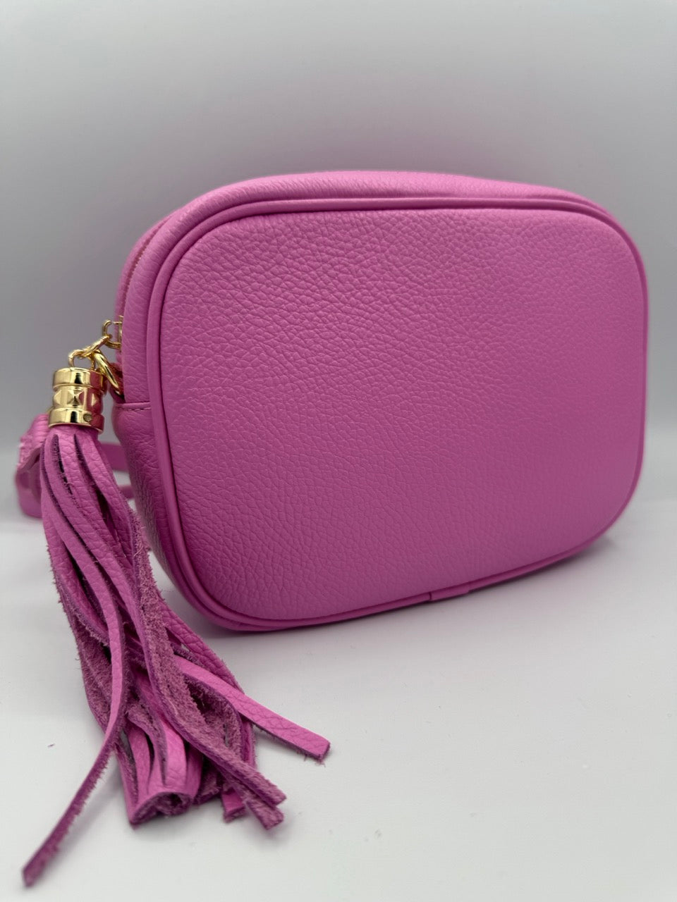 Borsa in ecopelle tinta unita con nappina laterale