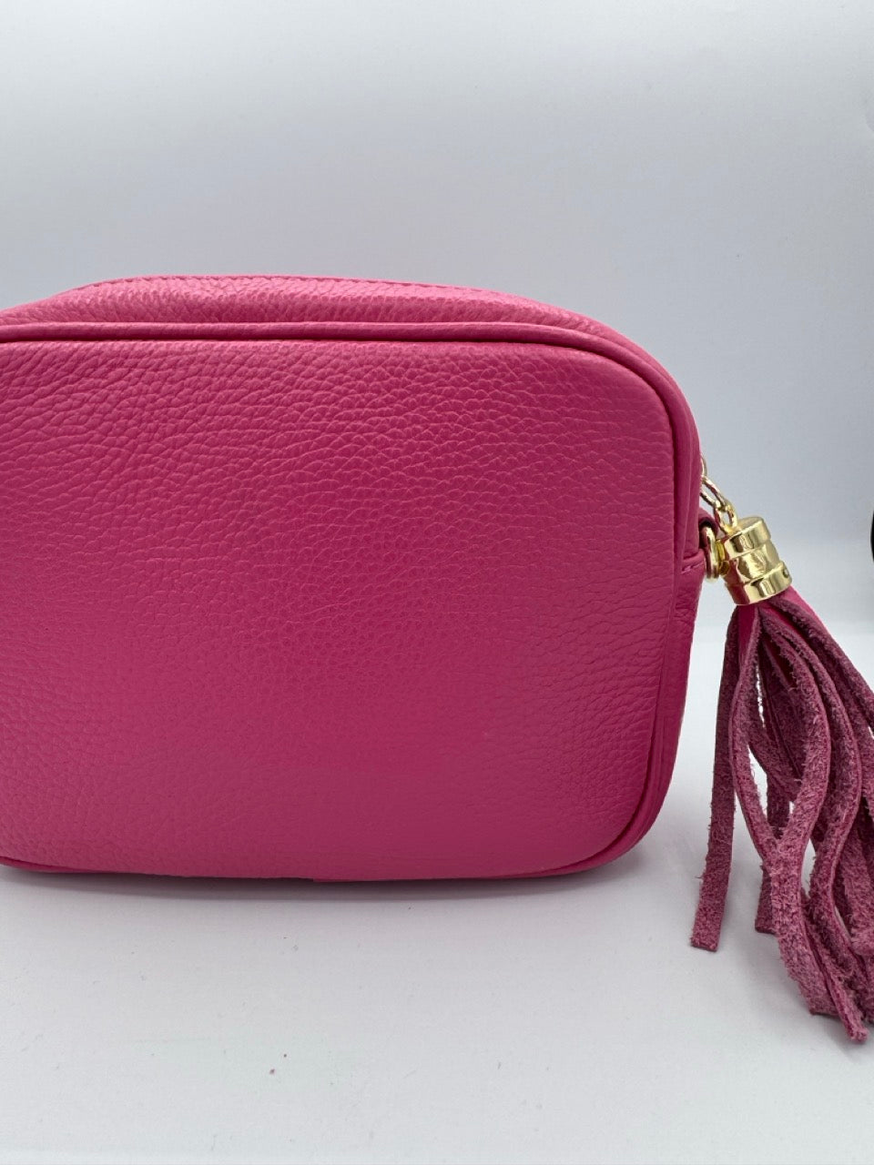 Borsa in ecopelle tinta unita con nappina laterale