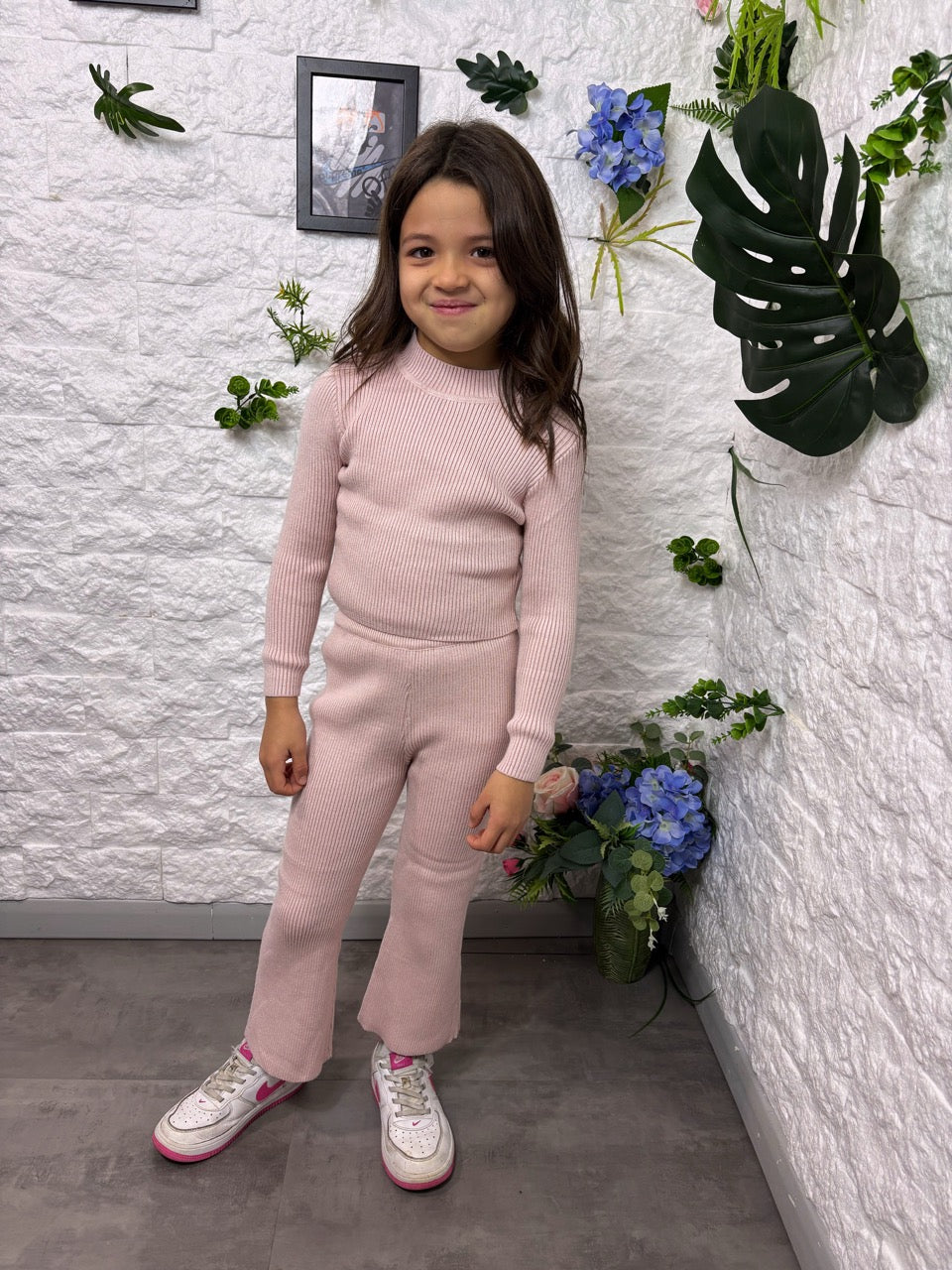 Completo rosa in maglia a costine con pantalone a zampa 4-14 anni