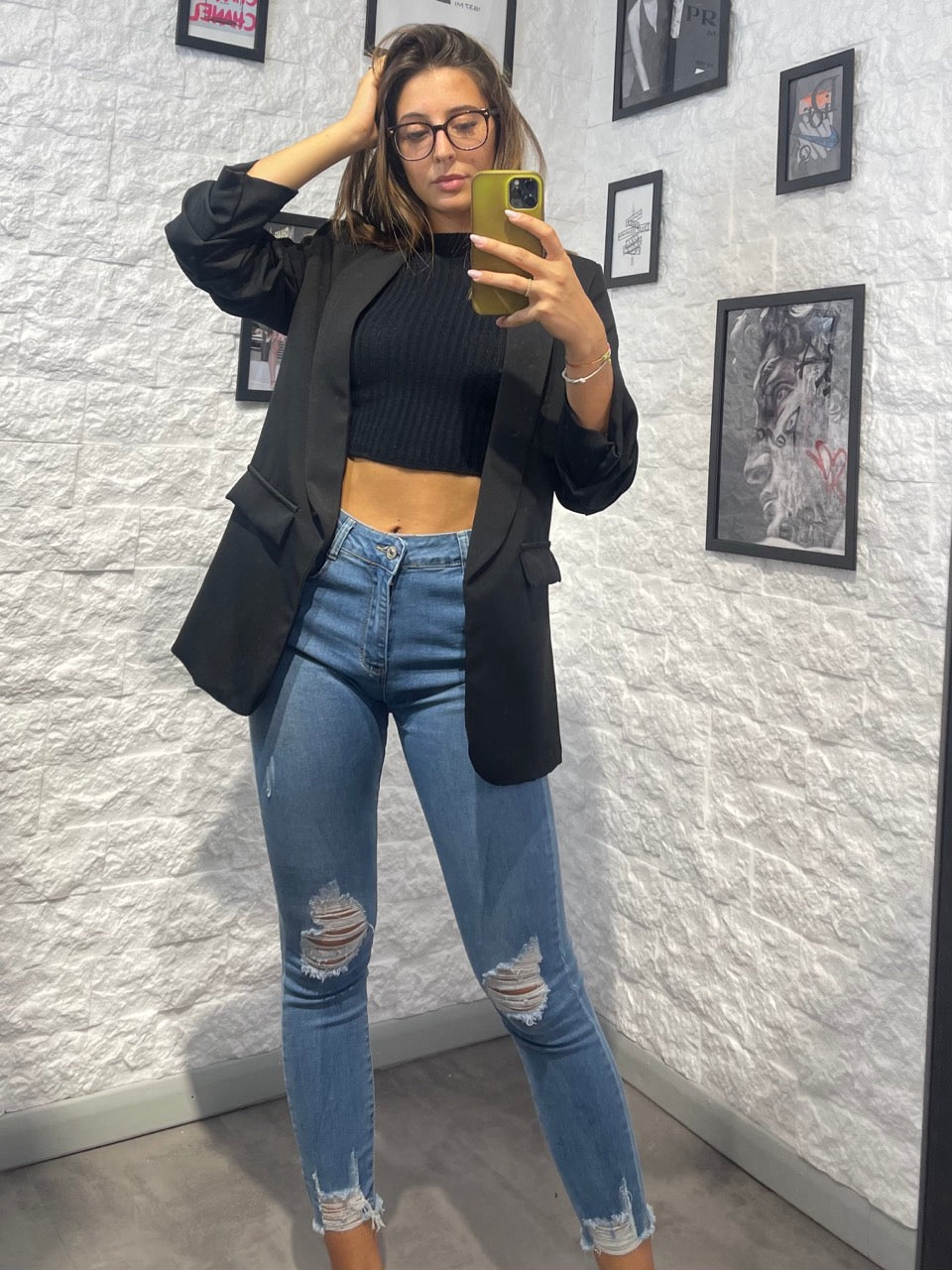 Jeans blu denim skinny con strappi su ginocchia e fondo