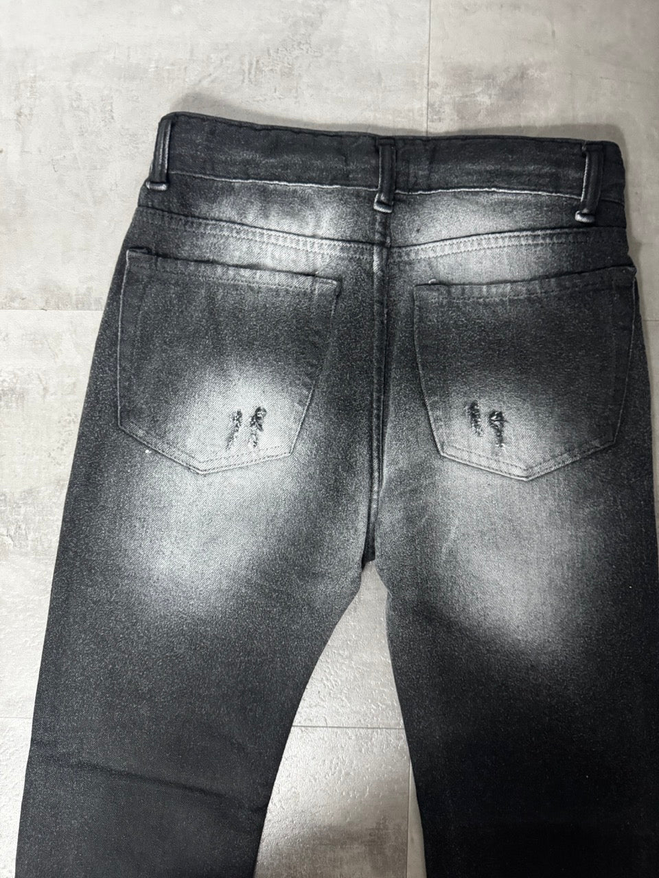 Jeans skinny nero slavato con strappi 10-16 anni