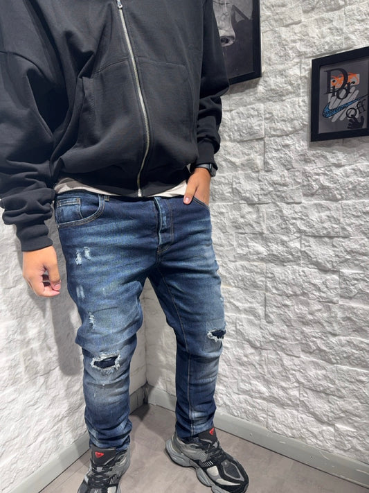 Jeans skinny blu in denim con strappi