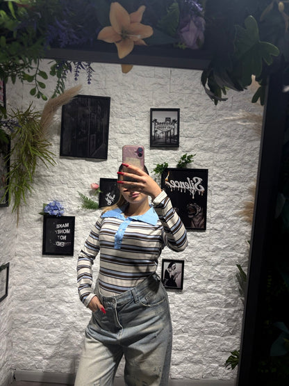 Maglia polo a righe con colletto e bottoni a manica lunga