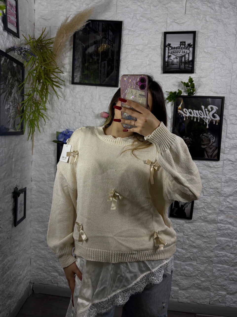 Maglioncino tinta unita con fiocchetti in raso applicati