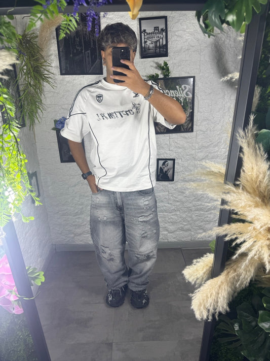 Jeans baggy grigio in denim con strappi e orlo sfrangiato