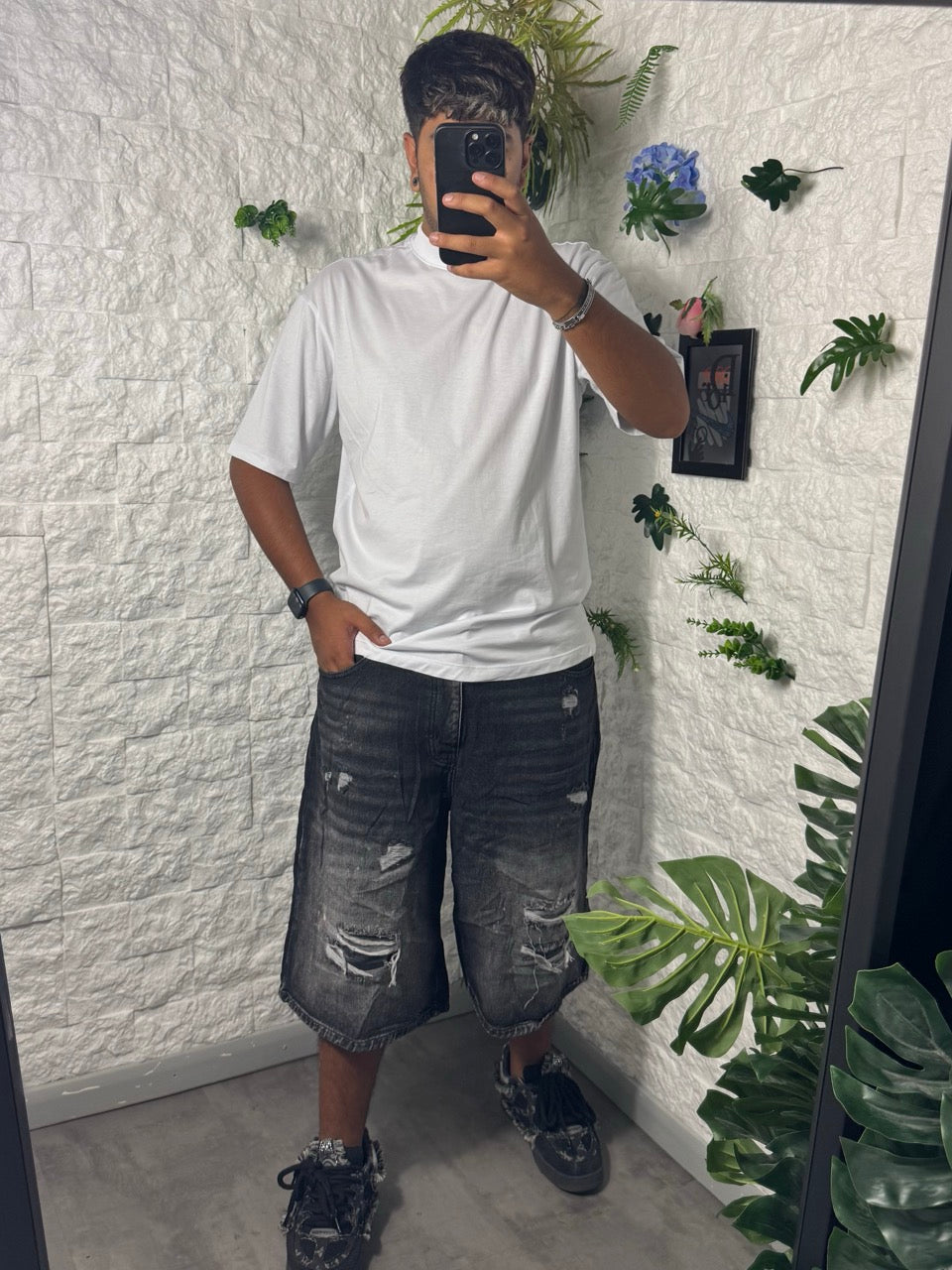 Jeans jorts denim nero slavato con strappi