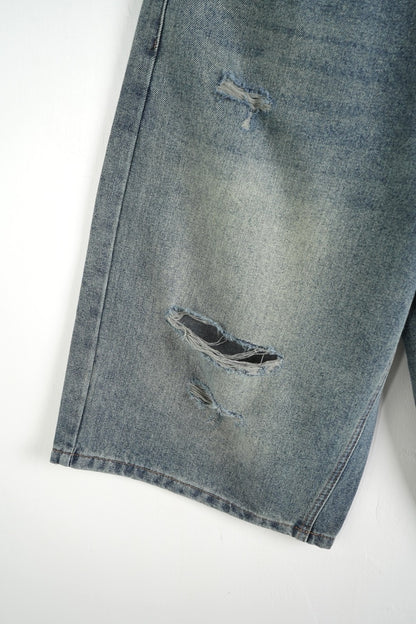 Jeans jort chiaro in denim con strappi