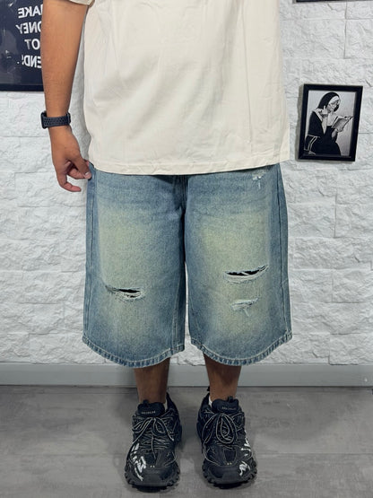 Jeans jort chiaro in denim con strappi