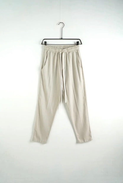 Pantalone beige in misto lino con elastico e laccio in vita