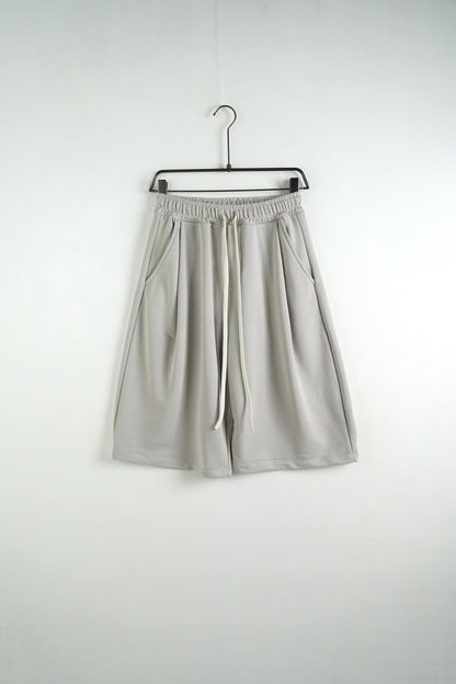 Bermuda uomo grigio chiaro balloon fit in tinta unita