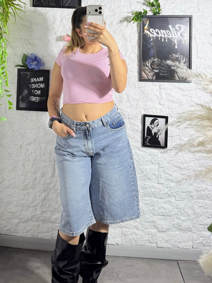 Jeans jort denim chiaro con tasca rosa brillantinata