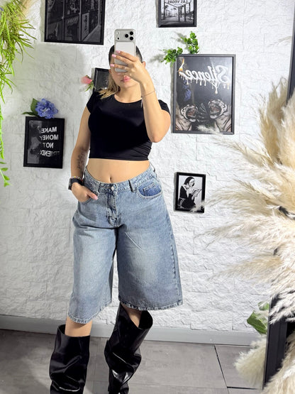 Jeans jort azzurro chiaro con tasca argento brillantinata