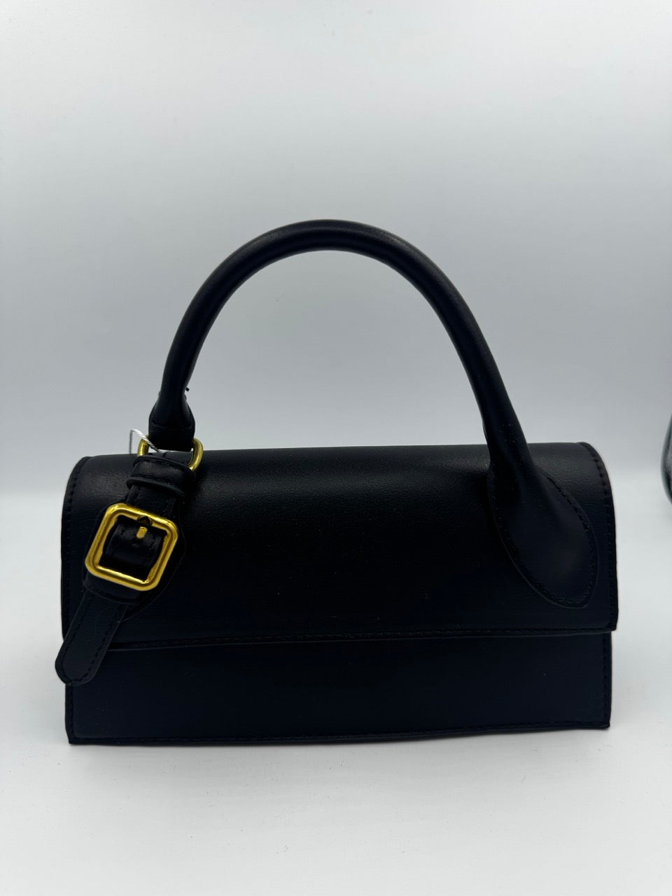 Borsa nera a mano in ecopelle con manico e fibbia dorata