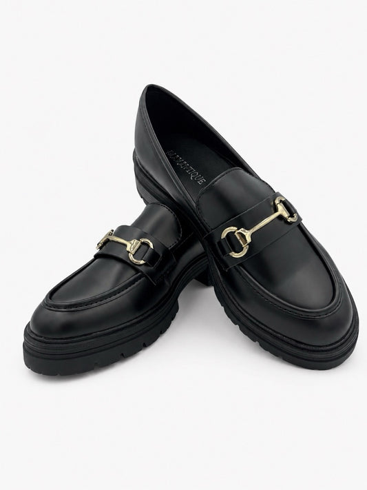 Mocassino nero con morsetto dorato e suola chunky