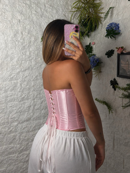 Corsetto rosa lucido con gancetti frontali e allacciatura sul retro