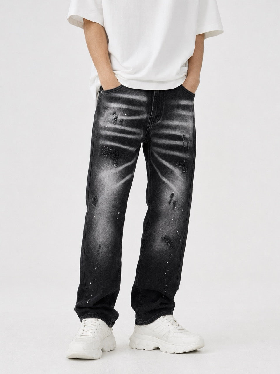 Jeans nero slavato con strappi e schizzi bianchi 10-16 anni
