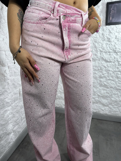 Jeans rosa slavato in denim con strass e vita asimmetrica