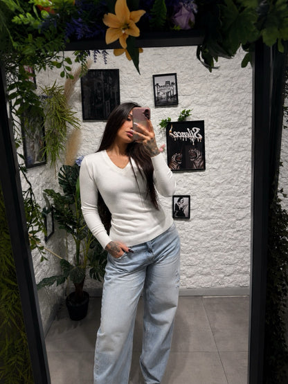 Maglione aderente in maglia elasticizzata con scollo a V