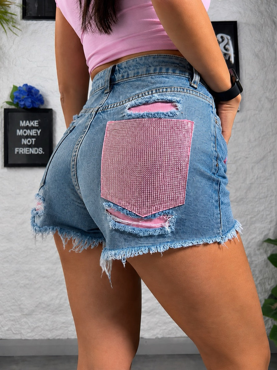 Shorts azzurro in denim con tasca rosa brillantinata