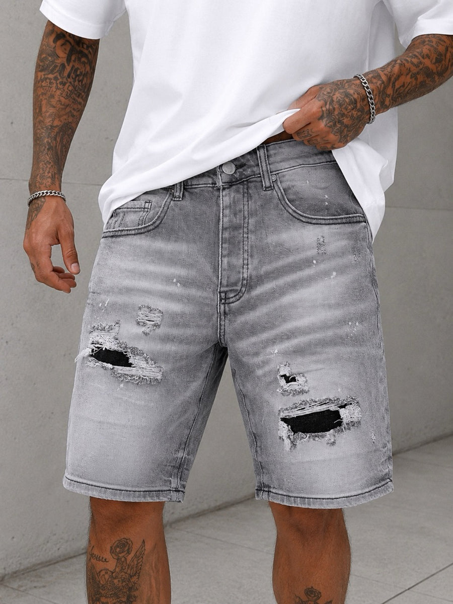Bermuda grigio chiaro in jeans con strappi e lavaggio slavato