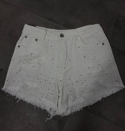 Short bianco in denim con brillantini e strappi