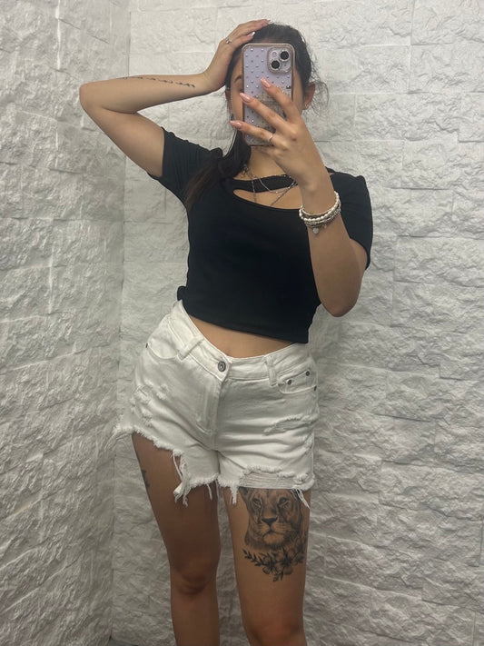 Short bianco in denim con strappi