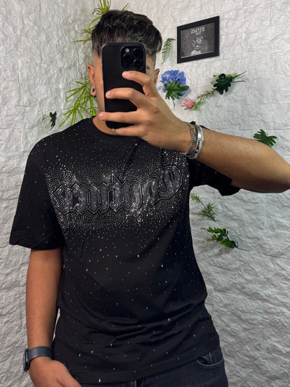 T-shirt nera brillantinata con scritta "COUTURE"