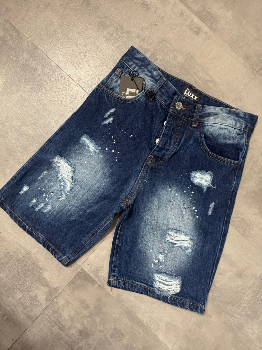 Pantaloncino bermuda blu in denim con strappi e schizzi di vernice