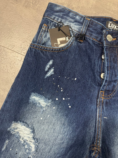 Pantaloncino bermuda blu in denim con strappi e schizzi di vernice - MOD DSQ