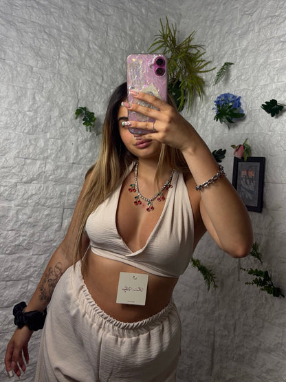 Completo in simil lino con top a triangolo e pantalone a palazzo