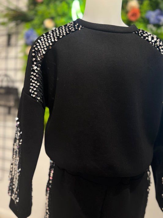 Completo felpa e pantalone nero con dettagli in paillettes 4-14 anni