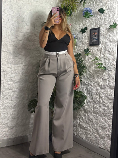 Pantalone a palazzo con pences e dettaglio in vita a effetto doppio